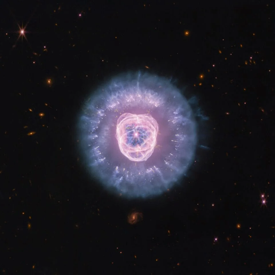 a large circular nebula in a dark sky