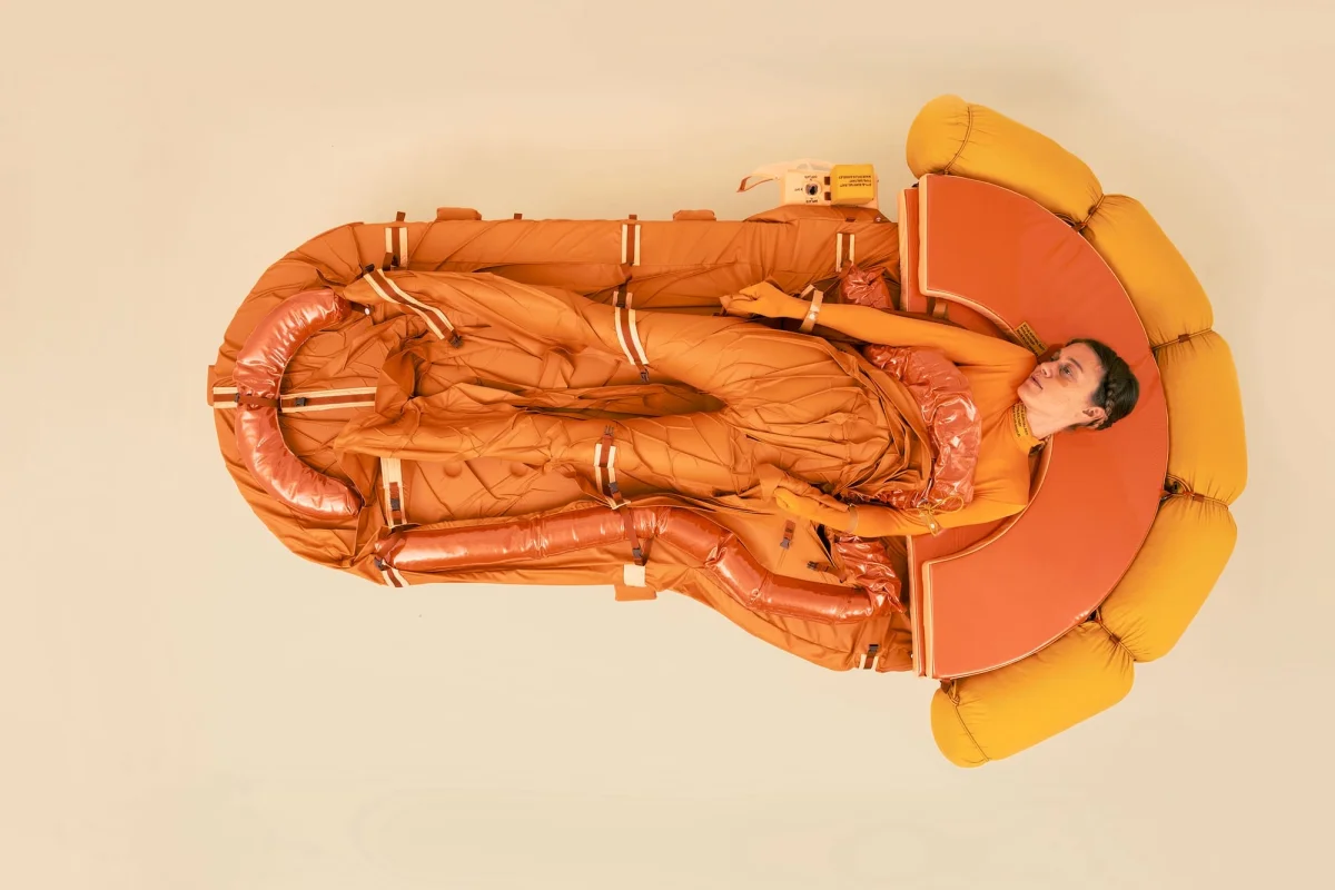 An orange, one-person survival raft sculpture