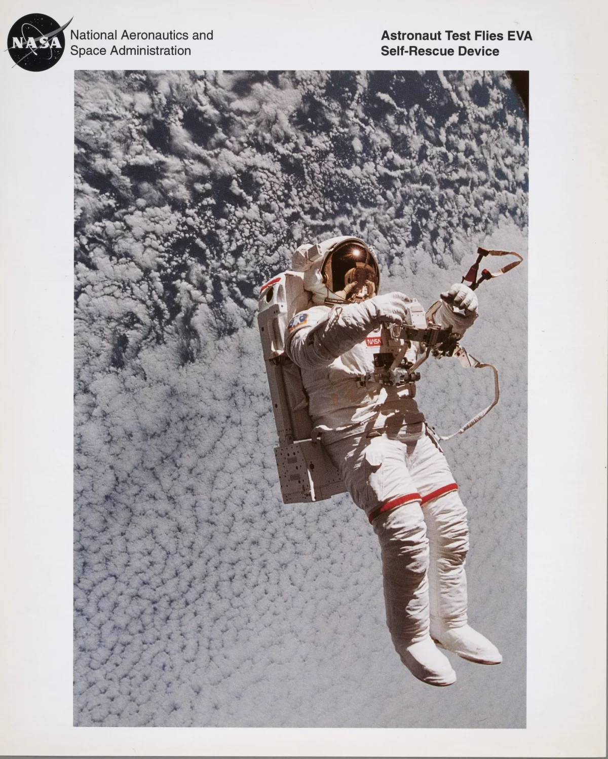 a photograph of an astronaut in space testing a self-rescue device